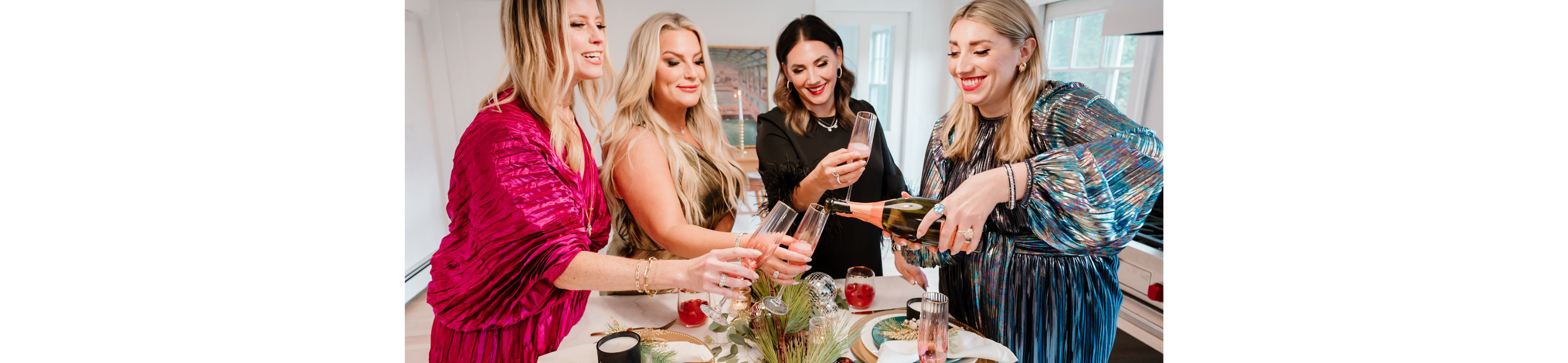 Four women toasting champagne