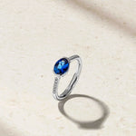 Mark Henry Mark Henry East-West Half Bezel 18k White Gold Blue Sapphire and Diamond Ring