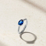 Mark Henry Mark Henry East-West Half Bezel 18k White Gold Blue Sapphire and Diamond Ring