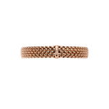 A gold mesh bracelet with a textured, woven appearance and a central clasp featuring a small vertical row of tiny clear stones, shown against a plain white background.
