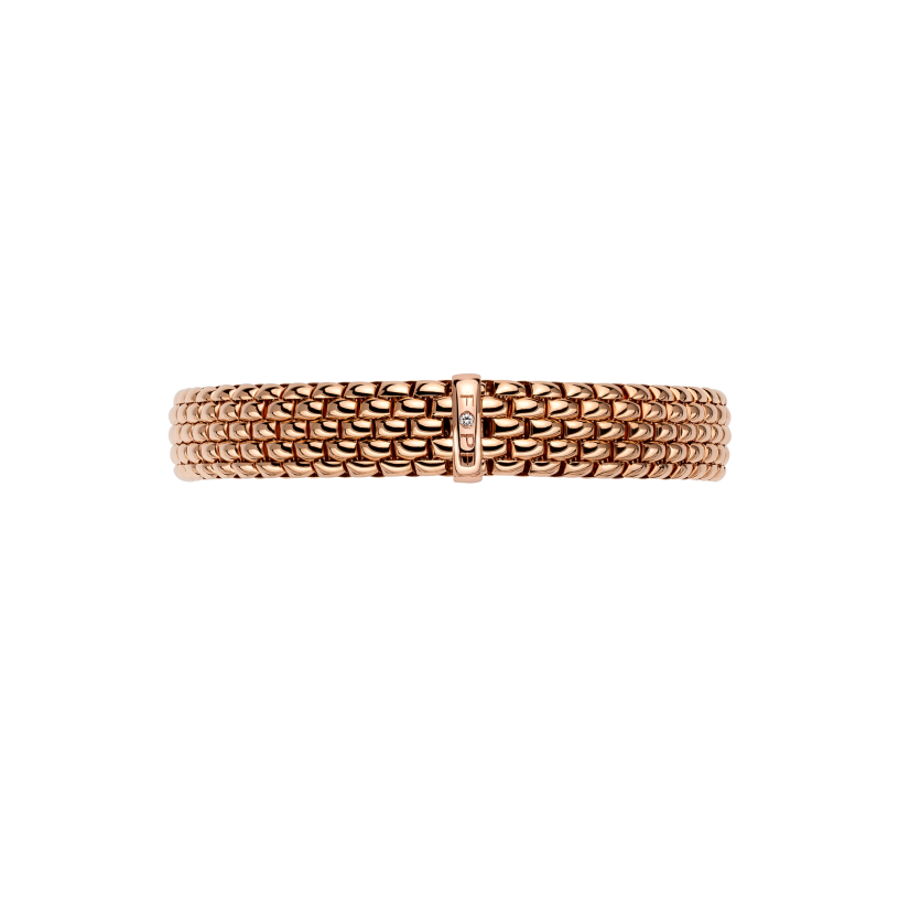 A gold mesh bracelet with a textured, woven appearance and a central clasp featuring a small vertical row of tiny clear stones, shown against a plain white background.