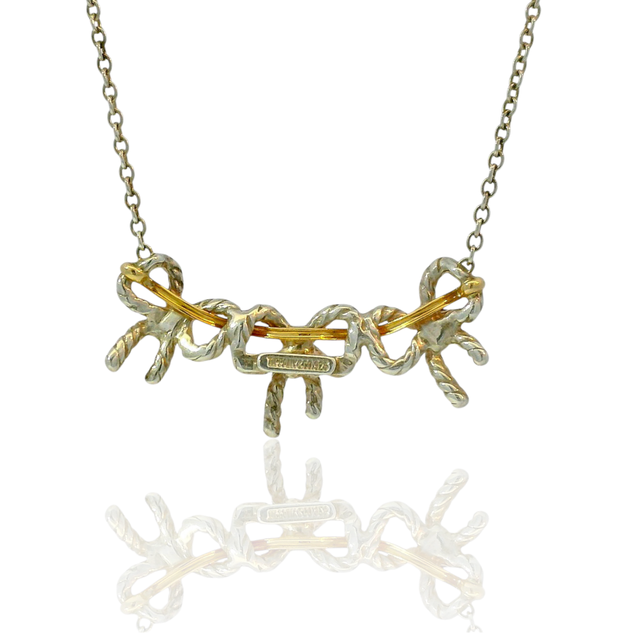 Estate Tiffany & Co. Necklaces and Pendants Tiffany & Co. Estate Sterling Silver & 18K Yellow Gold Three Bow Necklace