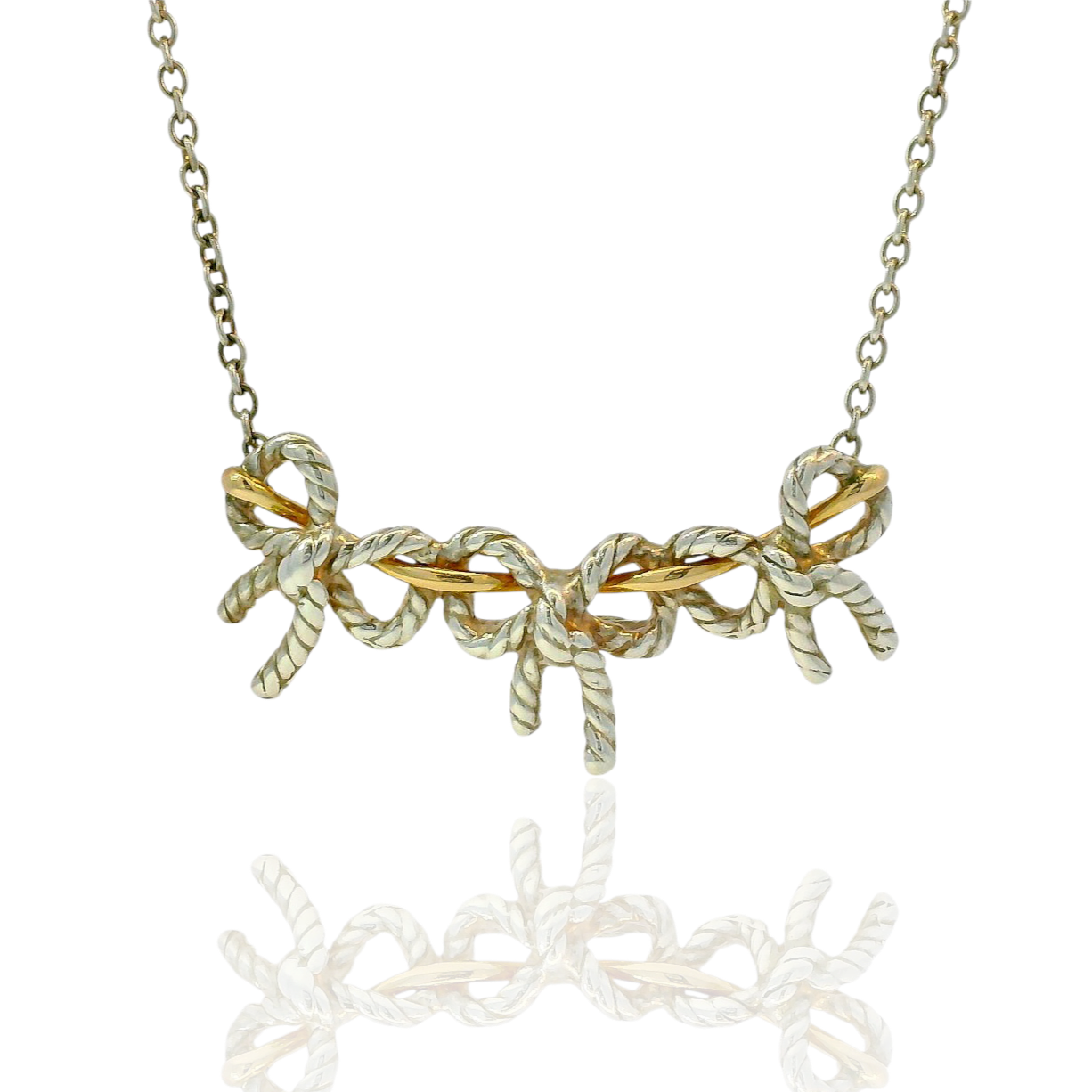Estate Tiffany & Co. Necklaces and Pendants Tiffany & Co. Estate Sterling Silver & 18K Yellow Gold Three Bow Necklace