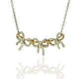 Estate Tiffany & Co. Necklaces and Pendants Tiffany & Co. Estate Sterling Silver & 18K Yellow Gold Three Bow Necklace
