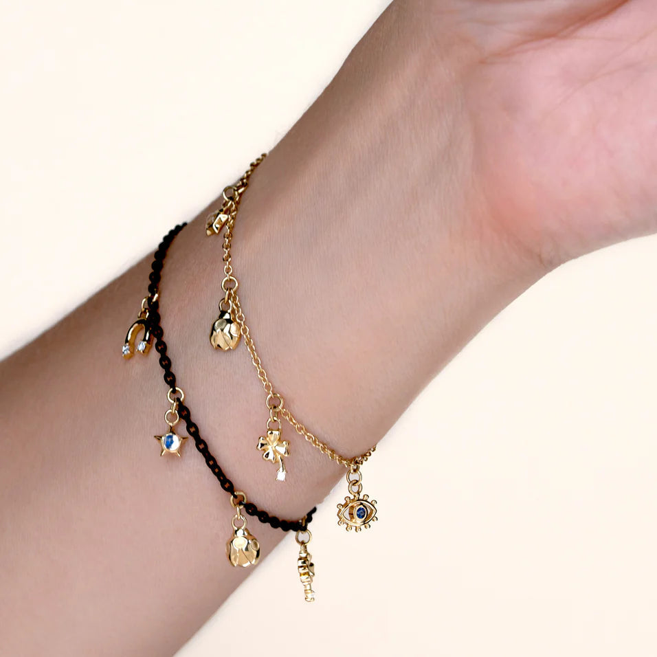Monica Rich Kosann Bracelet Monica Rich Kosann 18k Yellow Gold & Black Steel Luck Charm Bracelet